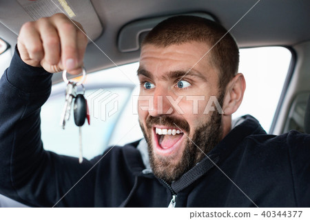Man shows keys from new car 40344377