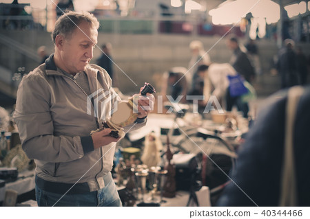 Man is visiting market of old things Man is visiting market of old things 40344466