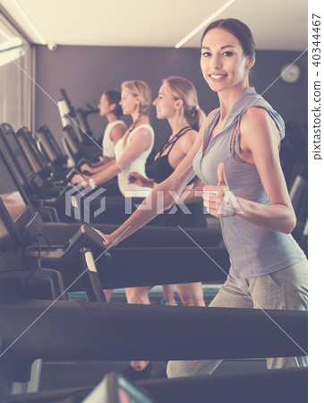 Satisfied girls running on treadmills Satisfied girls running on treadmills 40344467