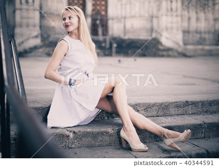portrait of woman sitting on steps 40344591