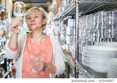 adult woman choosing glass for drink 40344667