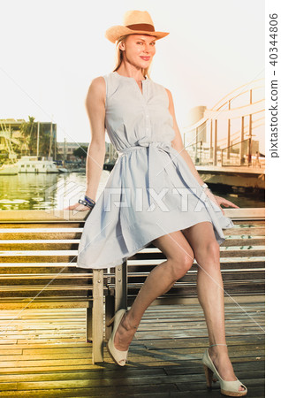 female in the hat near the marina bay female in the hat near the marina bay 40344806