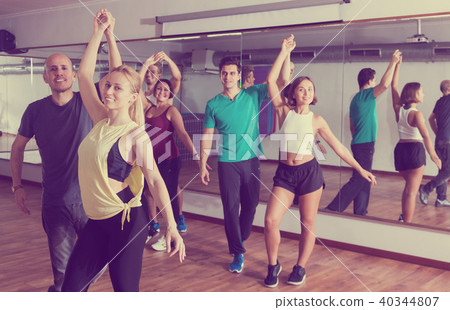 Group of positive people dancing bachata together Group of positive people dancing bachata together 40344807