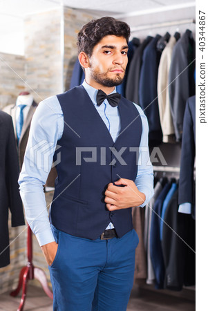 Customer male is demonstrating image in waistcoat with butterfly Customer male is demonstrating image in waistcoat with butterfly 40344867