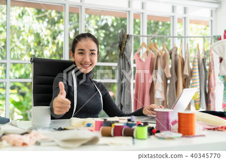 Happy asian smart looking fashion designer Happy asian smart looking fashion designer 40345770