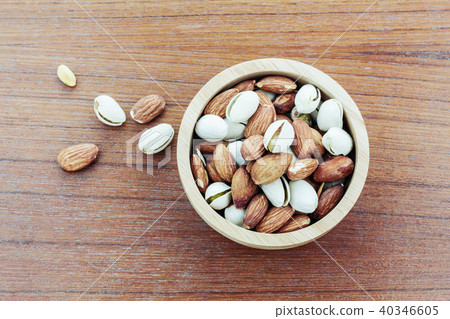 Almond in a bowl on wooden. Almond in a bowl on wooden. 40346605