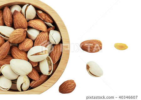 Almond in bowl on white background. Almond in bowl on white background. 40346607