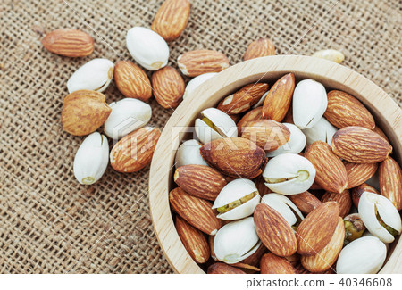 Almond in wooden bowl. Almond in wooden bowl. 40346608