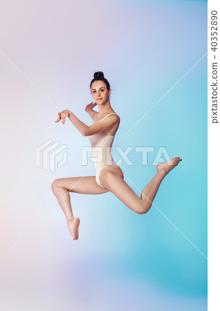 slim gymnast in beige swimsuit 40352890