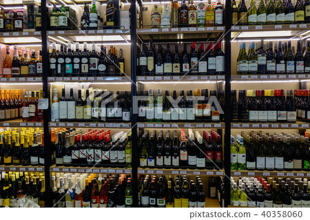 Shelves with varieties sorts of bottles of wine 40358060