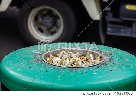 The cigarette on the ashtray 40358066