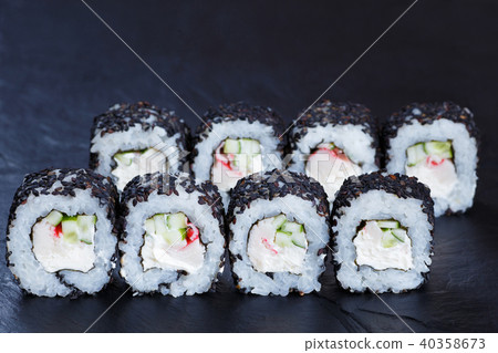 Tasty Japanese food. Sushi rolls with crab meat, cucumber and cr 40358673