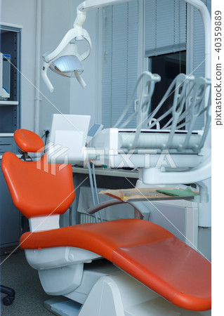 Modern dental practice. Dental chair and other accessories used Modern dental practice. Dental chair and other accessories used 40359889