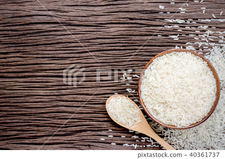 Rice bowl and spoon are placed on old wooden floor Rice bowl and spoon are placed on old wooden floor 40361737
