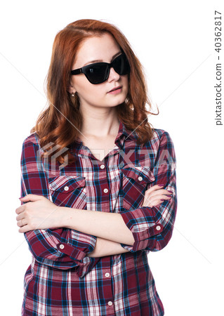 Young girl with arms crossed in plaid shirt Young girl with arms crossed in plaid shirt 40362817