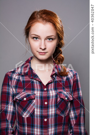 Portrait of a young red-haired girl in a plaid  40362847