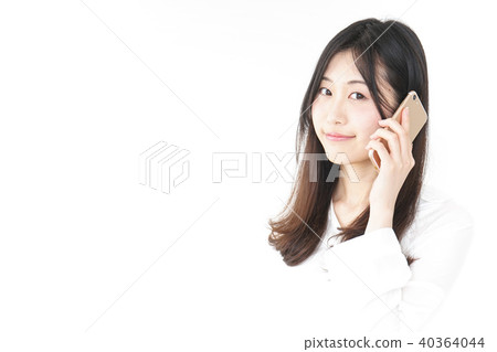 A woman using a smartphone A woman using a smartphone 40364044
