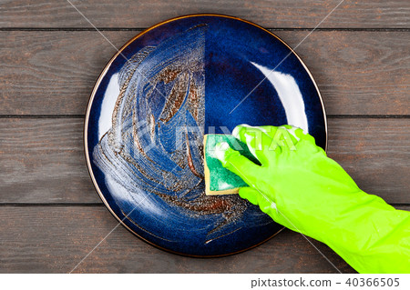 Blue plate on brown wooden table 40366505