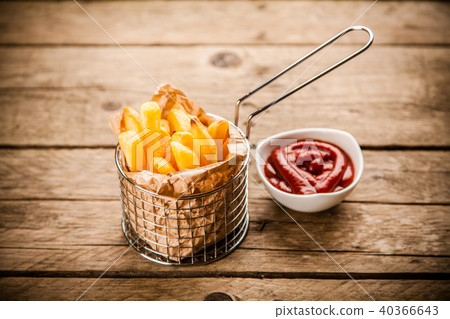 French fries on wooden table 40366643