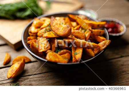 Baked potato fries on wooden table 40366961