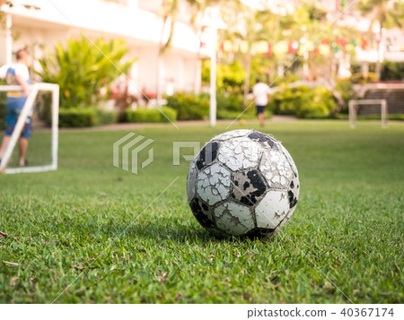 Old ball whit mini goal football and players 40367174