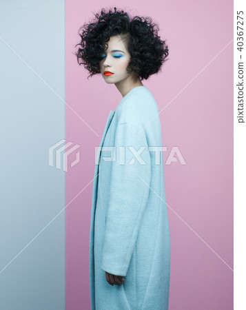 Fashion portrait of beautiful asian woman in sky-blue coat 40367275