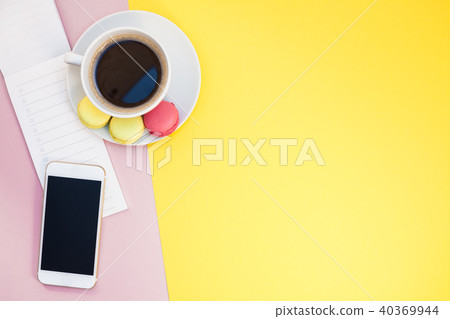 Creative flat lay with coffee cup and macaroons Creative flat lay with coffee cup and macaroons 40369944