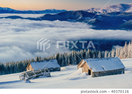 chalets in the mountains at sunset chalets in the mountains at sunset 40370116