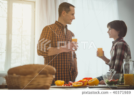 Man and boy enjoying healthy beverage Man and boy enjoying healthy beverage 40371989