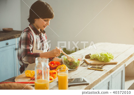 Little kid making healthy lunch himself Little kid making healthy lunch himself 40372010