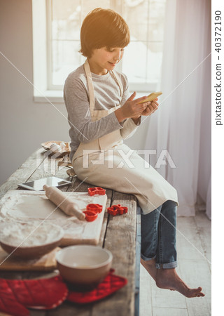 Child having break during cookies preparation 40372190