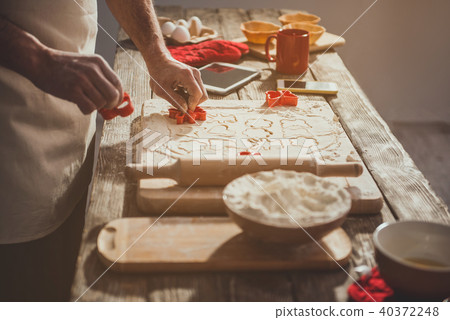 Male arms doing baby biscuits 40372248