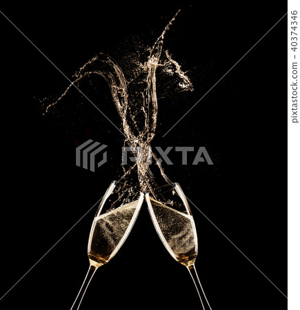 Champagne glasses on black background Champagne glasses on black background 40374346