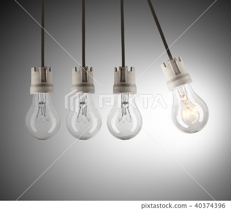 Light bulbs in row with single one shinning Light bulbs in row with single one shinning 40374396