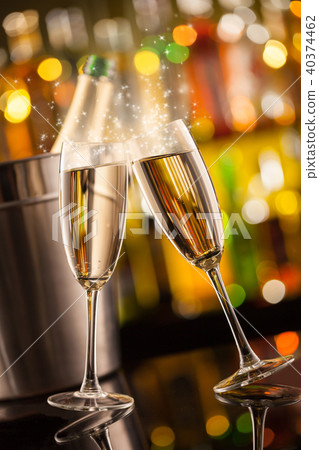 Glasses of champagne with blur background Glasses of champagne with blur background 40374462