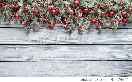 Christmas fir tree with decoration on a wooden board Christmas fir tree with decoration on a wooden board 40374645