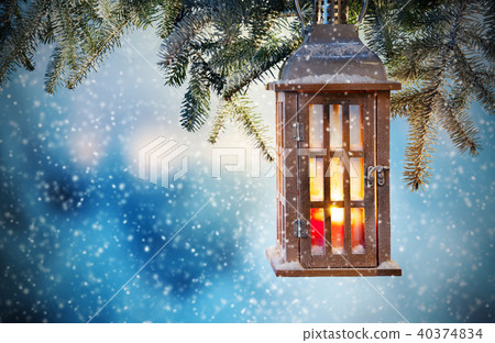 Christmas lantern hanging on fir branches Christmas lantern hanging on fir branches 40374834