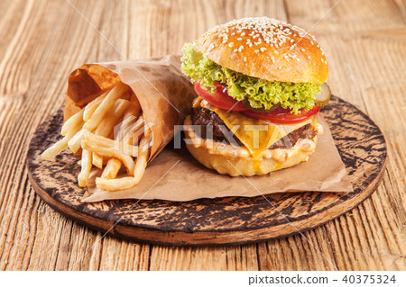 Fresh hamburger on wooden planks Fresh hamburger on wooden planks 40375324