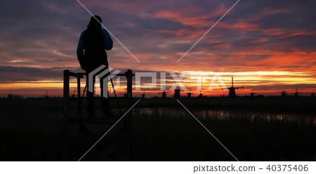 Silhouette of photographer with windmills 40375406