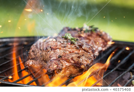 Beef steaks on grill 40375408