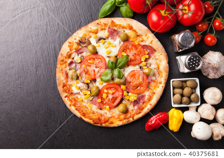 Delicious fresh pizza served on black stone 40375681