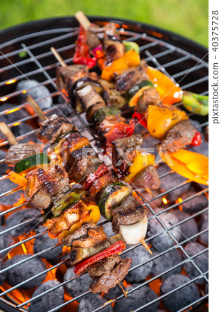 Delicious skewers on grill 40375728