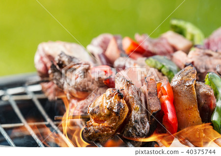 Delicious vegetable and meat skewer on grill Delicious vegetable and meat skewer on grill 40375744