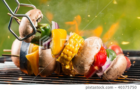 Delicious vegetable and meat skewer on grill Delicious vegetable and meat skewer on grill 40375750