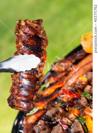 Delicious ribs on grill Delicious ribs on grill 40375762