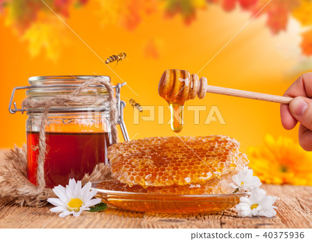 Fresh honey with dipper 40375936