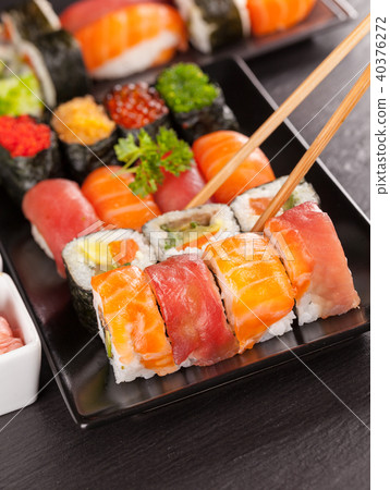 sushi pieces with chopsticks sushi pieces with chopsticks 40376272
