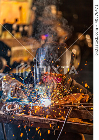 Welder in action. Low depth of focus 40376471