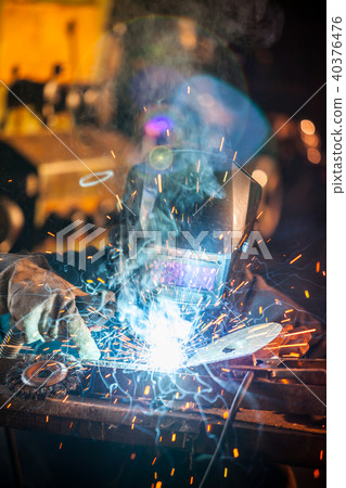 Welder in action. Low depth of focus Welder in action. Low depth of focus 40376476