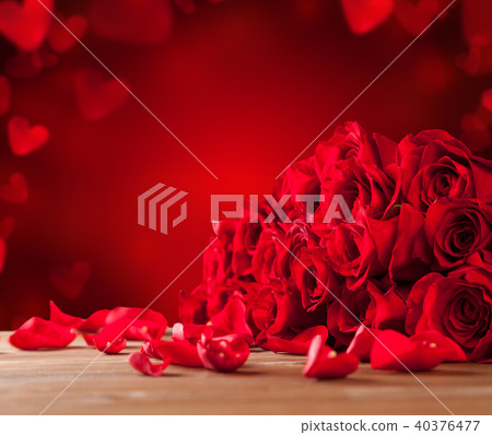 Bouquet of roses on wooden table Bouquet of roses on wooden table 40376477